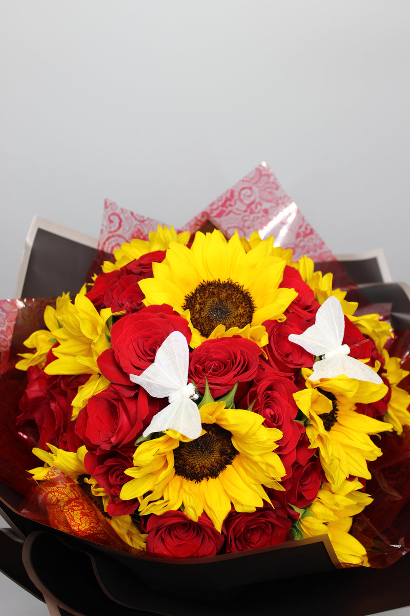 Paper wrapped Roses and sunflowers