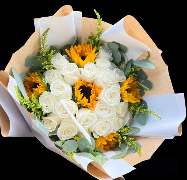 This is a gorgeous bouquet of 20-24 white roses and 5-8 sunflowers, exquisitely wrapped in waterproof paper and topped off with a bow. Surprise someone special and make lasting memories with this beautiful bouquet! Flower delivery available to local hospitals Houston Methodist,St. Lukes, Memorial Hermann and much more!